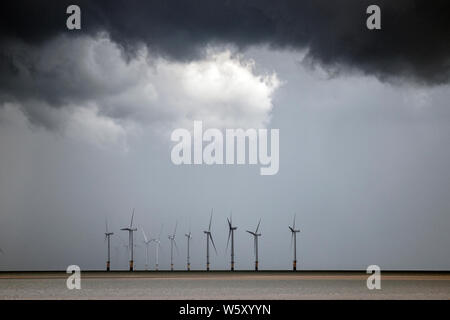 Crosby, Merseyside. 30th July 2019. UK Weather: Storm skies over Crosby Beach and the Irish sea. Credit; Credit: MediaWorldImages/Alamy Live News Stock Photo