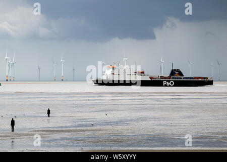 Crosby, Merseyside. 30th July 2019. UK Weather: Storm skies over Crosby Beach and the Irish sea. Credit; Credit: MediaWorldImages/Alamy Live News Stock Photo