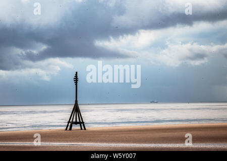 Crosby, Merseyside. 30th July 2019. UK Weather: Storm skies over Crosby Beach and the Irish sea. Credit; Credit: MediaWorldImages/Alamy Live News Stock Photo