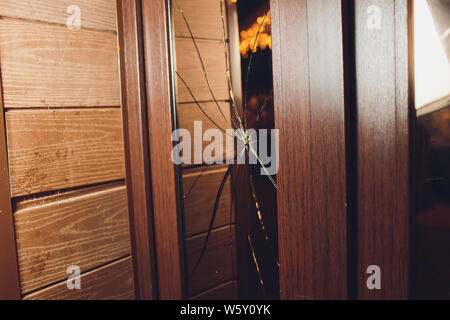 Broken glass black door of the shop. Stock Photo