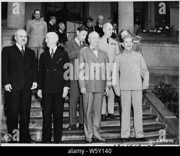 Soviet leader Josef Stalin meets President Harry S. Truman for the first time at the Little White House, the residence of President Truman during the Potsdam Conference in Germany. L to R: Vyacheslav Molotov, Soviet foreign minister, Secretary of State James Byrnes, Charles Bohlen, interpreter for President Truman (slightly behind), President Truman, Adm. William Leahy (slightly behind), Josef Stalin. Stock Photo