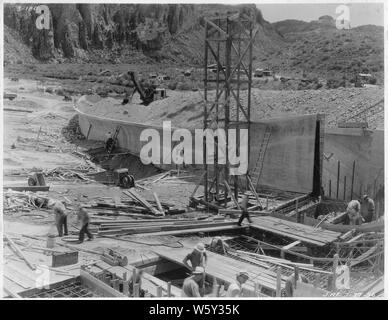 Stewart Mountain spillway. View looking downstream along right wall showing progress of concreting and backfilling.; Scope and content:  Photograph from Volume One of a series of photo albums documenting the construction of Roosevelt Dam, Stewart Dam, and other related work on the Salt River Project in Arizona. Stock Photo