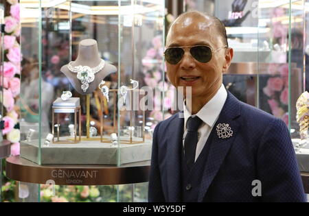 Renowned shoe designer Jimmy Choo is pictured at the stand of luxury company Genavant during the First China International Import Expo (CIIE) and the Stock Photo