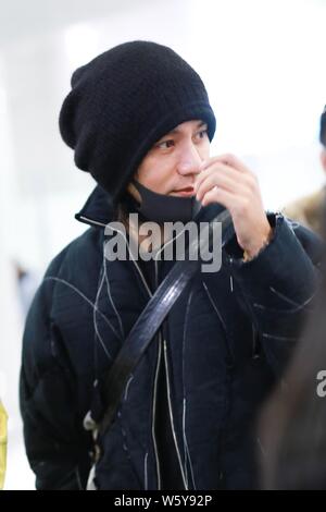 Chinese actor and singer Aloys Chen Kun leaves the Shanghai Hongqiao International Airport as he is absent from the Italian fashion brand Dolce and Ga Stock Photo