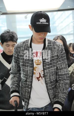 Chinese actor Connor Leong or Liang Jingkang of the new lineup of Chinese boy group F4 arrives at the Shanghai Hongqiao International Airport after la Stock Photo