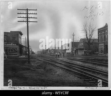 Town of Haubstadt, Indiana; Scope and content:  Various street scenes showing the John F. Halbig General Merchandise store, other businesses, railroad tracks, Model T car, and horse and buggy. In photo #94 the date on the Halbig building is 1877. Stock Photo