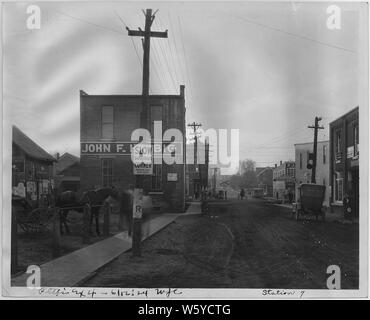 Town of Haubstadt, Indiana; Scope and content:  Various street scenes showing the John F. Halbig General Merchandise store, other businesses, railroad tracks, Model T car, and horse and buggy. In photo #94 the date on the Halbig building is 1877. Stock Photo