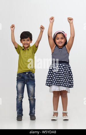 Two girls friends smiling with their arms around each other Stock Photo ...