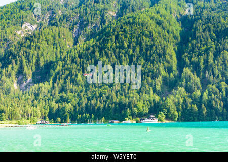 Weißensee: lake Weißensee east end, restaurant Dolomitenblick, SUP, rescue helicopter in , Kärnten, Carinthia, Austria Stock Photo