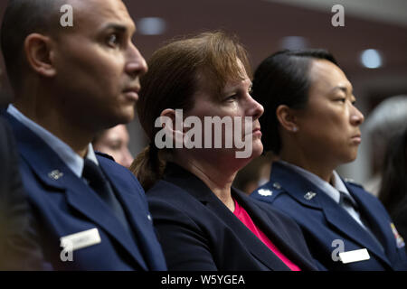 Washington DC, USA. 30th July 2019. United States Army Colonel Kathryn Spletstoser, center, who has said she was sexually assaulted by US Air Force General John E. Hyten, listens to the testimony before the US Senate Committee on Armed Services during his confirmation hearing on Capitol Hill in Washington, DC, U.S. on July 30, 2019. Credit: Stefani Reynolds/CNP/ZUMA Wire/Alamy Live News Stock Photo