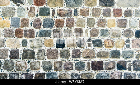wall made of colorful cubic stones Stock Photo