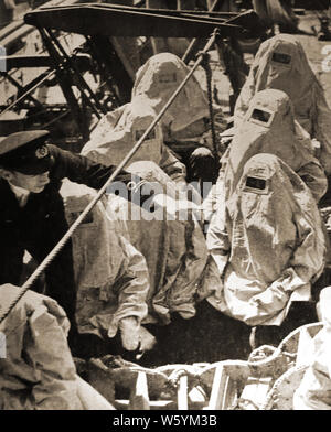 WWII - UK Naval personnel were issued with  protective asbestos clothing when working on oil tankers to protect them in case of fire. Stock Photo