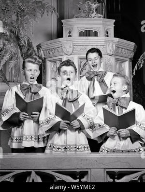 1940s THREE SINGING SMILING INNOCENT CHOIRBOYS EYING FOURTH GUILTY BOY STANDING IN MIDDLE WITH BIG BLACK EYE LOOKING AT CAMERA - c2811 HAR001 HARS TEAMWORK COMPETITION PLEASED JOY LIFESTYLE SATISFACTION RELIGION CELEBRATION HEALTHINESS COPY SPACE FRIENDSHIP HALF-LENGTH INSPIRATION FOURTH MALES RISK SPIRITUALITY SKIN B&W EYE CONTACT PERFORMING ARTS VISION TEMPTATION CHEERFUL ADVENTURE STRENGTH COURAGE POWERFUL IN SMILES BLACK EYE SURROUNDING CONCEPTUAL JOYFUL STYLISH BRUISE CHOIRBOY CHOIRBOYS GROWTH GUILTY HONORABLE JUVENILES PRE-TEEN PRE-TEEN BOY SHINER SOLUTIONS SOMEONE TOGETHERNESS Stock Photo