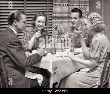 1930s TWO COUPLES DINING AT A TABLE DRINKING COFFEE - d2555 HAR001 HARS JOY LIFESTYLE CELEBRATION FEMALES STUDIO SHOT HEALTHINESS COPY SPACE FRIENDSHIP HALF-LENGTH LADIES PERSONS MALES B&W SUIT AND TIE HAPPINESS CHEERFUL LEISURE STYLES SMILES CONNECTION GOOD TIME DINNER PARTY DINNERS JOYFUL STYLISH COOPERATION DINE FASHIONS MID-ADULT MID-ADULT MAN MID-ADULT WOMAN TOGETHERNESS YOUNG ADULT MAN YOUNG ADULT WOMAN BLACK AND WHITE CAUCASIAN ETHNICITY HAR001 OLD FASHIONED Stock Photo