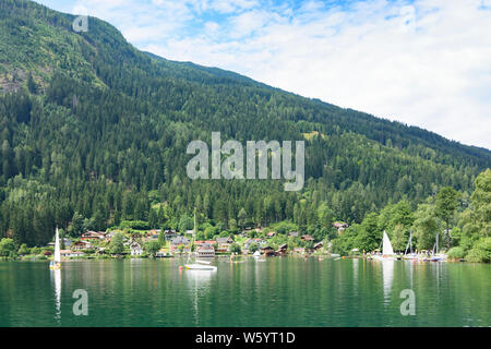 Feld am See: lake Brennsee, village Feld am See in , Kärnten, Carinthia, Austria Stock Photo