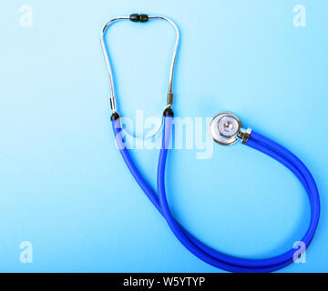 A heart with a medical stethoscope, isolated on white background Stock Photo