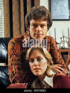 1970s PORTRAIT OF YOUNG COUPLE MAN WEARING ORANGE PRINT SHIRT AND BLONDE WOMAN LOOKING AT CAMERA - ks14510 HAR001 HARS SPOUSE HUSBANDS HOME LIFE COPY SPACE FRIENDSHIP LADIES PERSONS MALES ORANGE EXPRESSIONS CONCERNED PARTNER EYE CONTACT HEAD AND SHOULDERS AND PRIDE CONNECTION STYLISH SINCERE GENUINE STRAIGHTFORWARD COOPERATION INTENSE MID-ADULT MID-ADULT MAN MID-ADULT WOMAN TOGETHERNESS WIVES CAUCASIAN ETHNICITY DIRECT HAR001 OLD FASHIONED Stock Photo