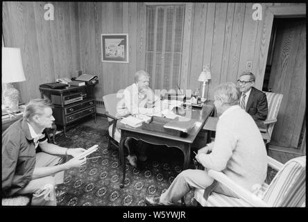 Zbigniew Brzezinski, Jimmy Carter, Cyrus Vance and Harold Brown confer on the mid-east peace accords at Camp David. Stock Photo