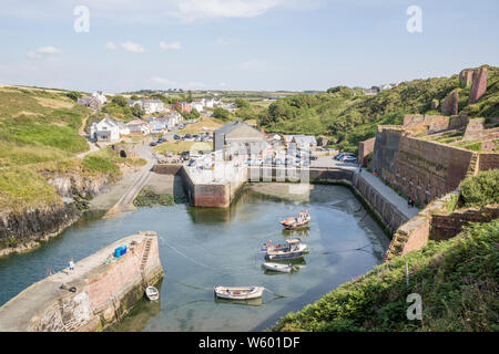 The harbour at Porthgain a coastal village within the Pembrokeshire Coast National Park, Wales, UK Stock Photo