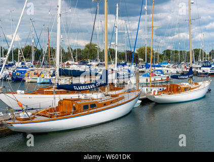 Traditional or classic wooden sailing boats moored in Premier Marinas - Chichester Marina ,Chichester Harbour, West Sussex, England, UK Stock Photo