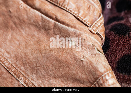 Leather jacket damaged, worn out Stock Photo