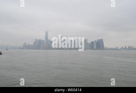 Spring in New York City: Hazy Lower Manhattan Skyline on an Overcast Day Stock Photo