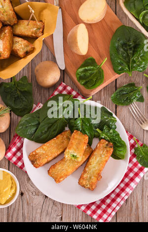 Potato croquettes with spinach and mozzarella. Stock Photo