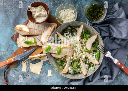 Salad with cottage cheese, Romano leaves, sweet pear and cheese. Cream Cheese Biscuits with Pear Slices Stock Photo