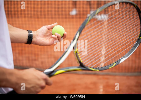 Fit happy poeple playing tennis together. Sport concept Stock Photo