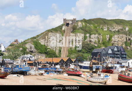 Fishing boats on The Stade and the  East Hill Cliff Railway or East Hill Lift, the  funicular railway at Rock-A-Nore in Hastings. Hastings, Sussex, UK Stock Photo