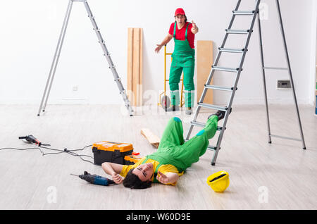 The injured worker and his workmate Stock Photo