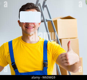 The painter contractor working with virtual reality goggles Stock Photo