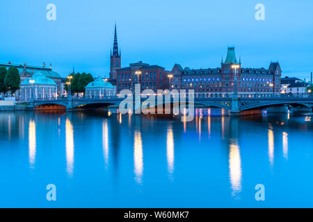 Vasabron Bridge with House of Nobility (Riddarhuset) and Norstedt Building in background along Norrstrom river, Stockholm, Sweden Stock Photo