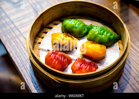 Colourful dumplings, Steamed dim sum platter at Baozi Inn, Market Hall Victoria, London, UK Stock Photo