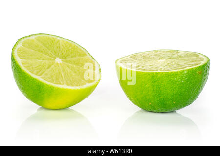 Group of two halves of fresh green lime isolated on white background Stock Photo