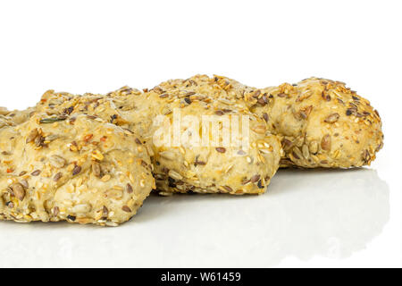 Closeup of three whole fresh cereal baguette isolated on white background Stock Photo