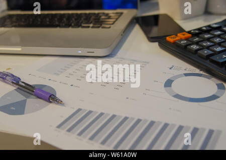 Business Analytics with a Laptop and pen. Stock Photo