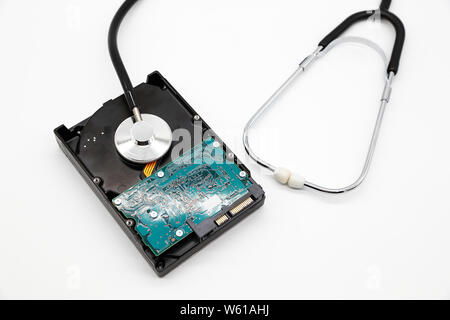 stethoscope with hard disk isolated and white background (this image for technology security checkup concept) Stock Photo