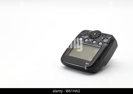 closeup camera flash trigger on isolated background Stock Photo