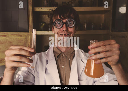Crazy scientist in his lab doing experiments Stock Photo
