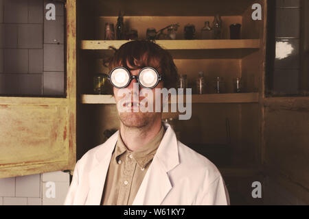 Crazy scientist in his lab doing experiments Stock Photo