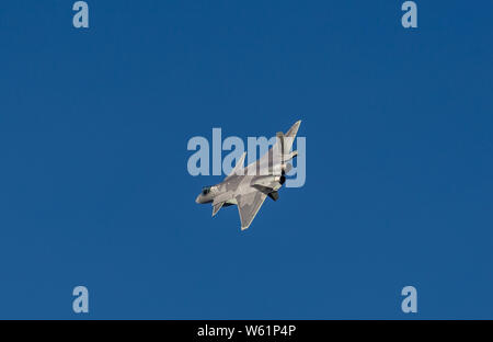 A J-20 stealth fighter jet of the Chinese PLA (People's Liberation Army) Airforce flies during a training session in preparation for the 12th China In Stock Photo