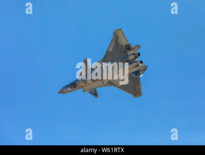 A J-20 stealth fighter jet of the Chinese PLA (People's Liberation Army) Airforce flies during a training session in preparation for the 12th China In Stock Photo