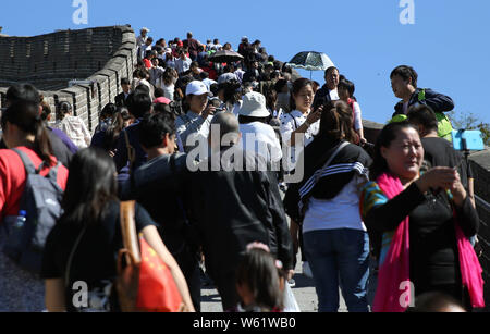 Crowds of Chinese tourists visit the Badaling Great Wall during the week-long National Day holiday in Beijing, China, 3 October 2018.   A total of 502 Stock Photo