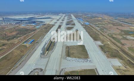 An aerial view of the Qingdao Jiaodong International Airport under construction in Jiaozhou on the outskirts of Qingdao city, east China's Shandong pr Stock Photo