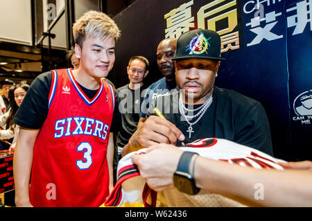 Chinese fans show team jerseys of retired NBA star Allen Iverson