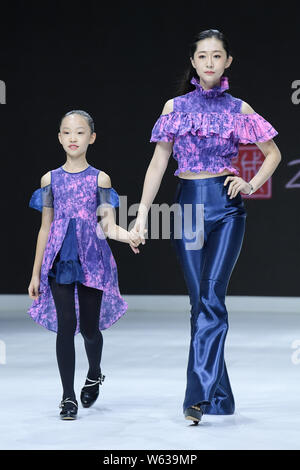 Models display new creations at the Dream x Classic of Mountains and Seas fashion show during the 2018 Beijing Fashion Week in Beijing, China, 21 Sept Stock Photo