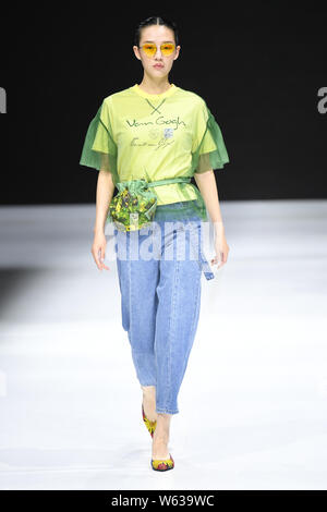 A model displays a new creation at the JD x Something fashion show during the 2018 Beijing Fashion Week in Beijing, China, 17 September 2018. Stock Photo