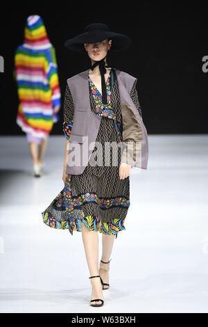 A model displays a new creation at the JD x Something fashion show during the 2018 Beijing Fashion Week in Beijing, China, 17 September 2018. Stock Photo