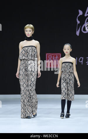 Models display new creations at the Dream x Classic of Mountains and Seas fashion show during the 2018 Beijing Fashion Week in Beijing, China, 21 Sept Stock Photo